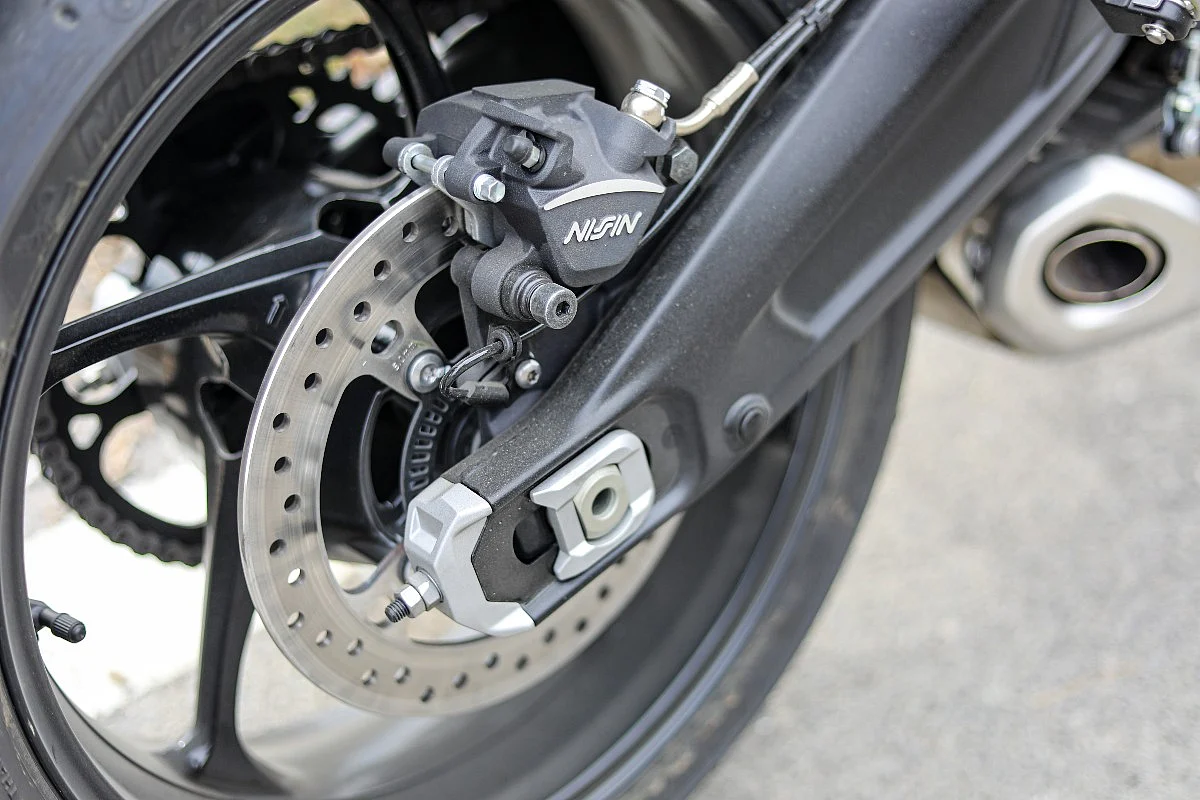 The Trident 660 gets a two-pot Nissin caliper upfront and a single-pot caliper at the rear
