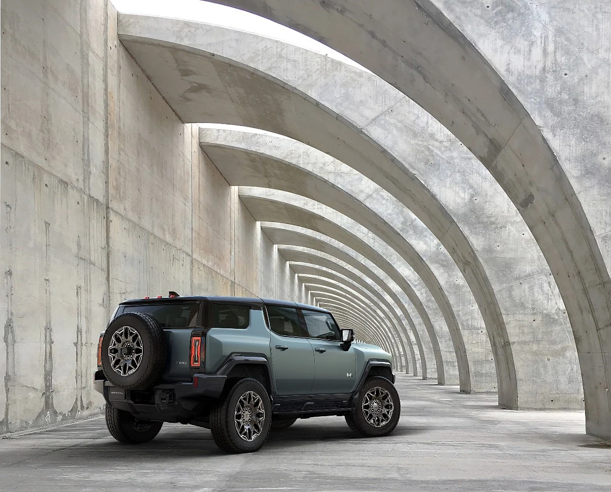 The Hummer EV SUV gets a tailgate mounted spare wheel, much like Hummers of the past