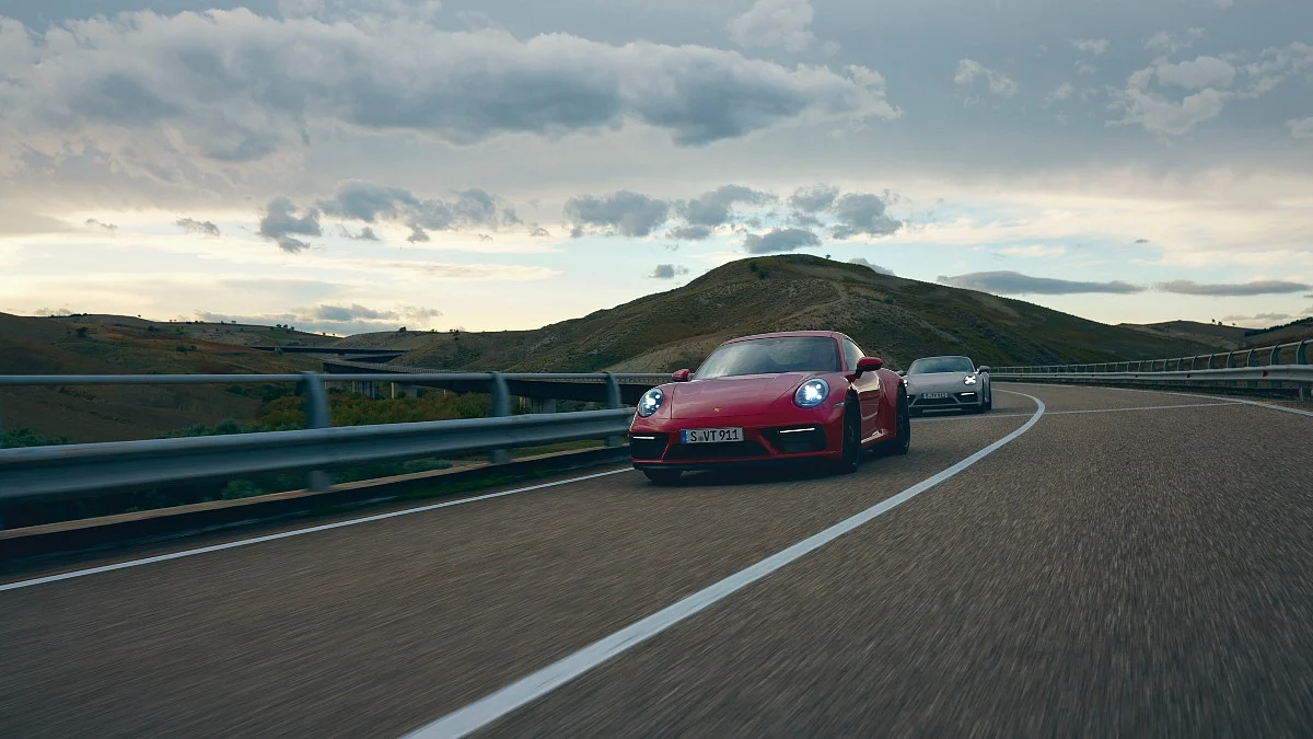 The new 911 GTS is available in coupe and cabriolet (pictured behind) forms