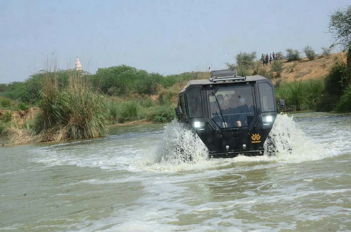The Sherp's 71-inch tyres double up as flotation devices and propellers as well