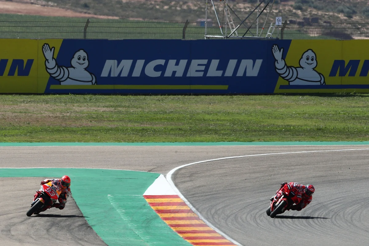 This picture captures the moment where Marquez runs wide on his last overtake attempt and hands Bagnaia the victory on the last lap.