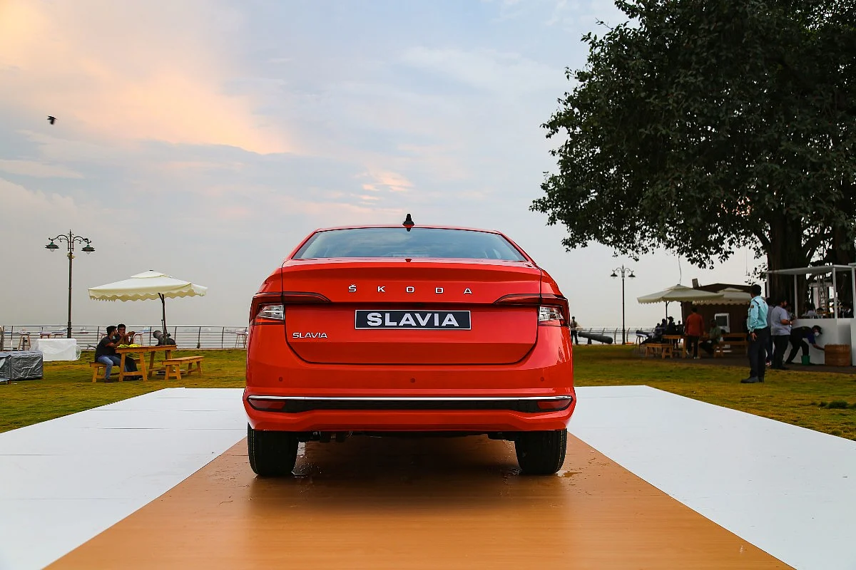 There is a chrome strip running across the length of the rear bumper