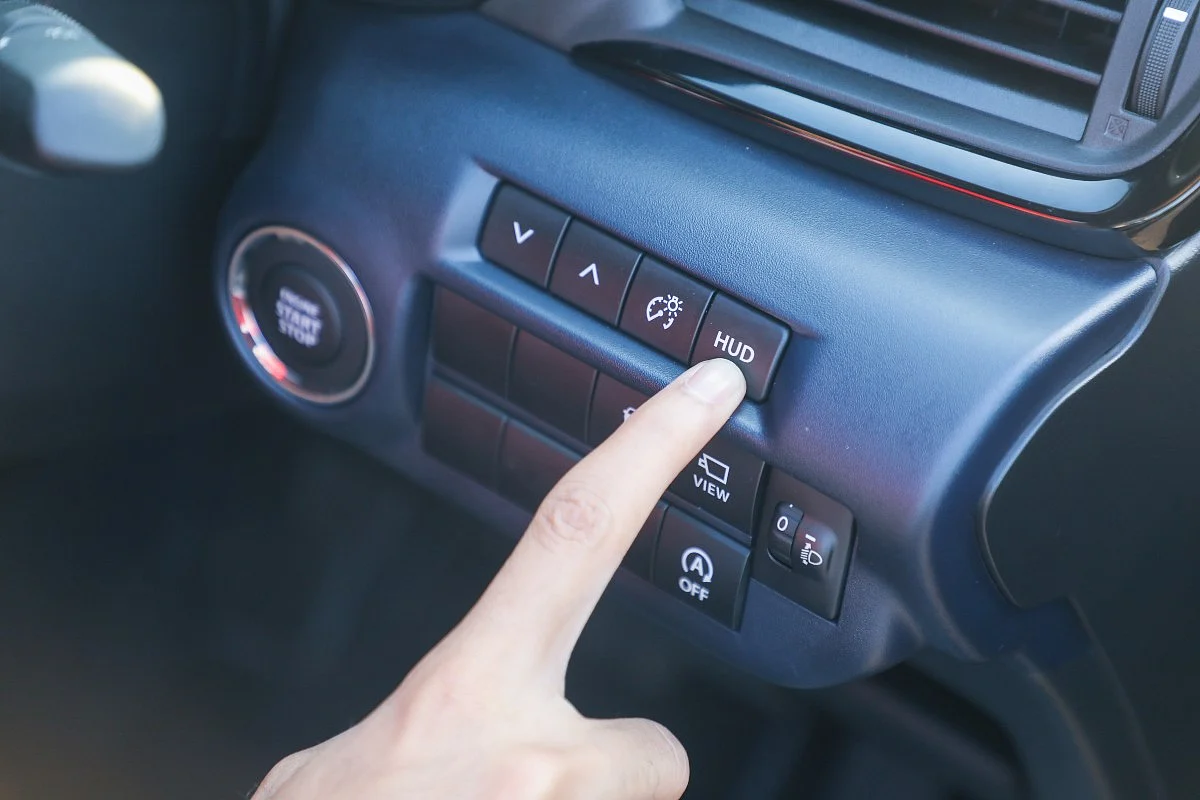 The HUD can be stowed away via this switch near the push-button starter when not needed