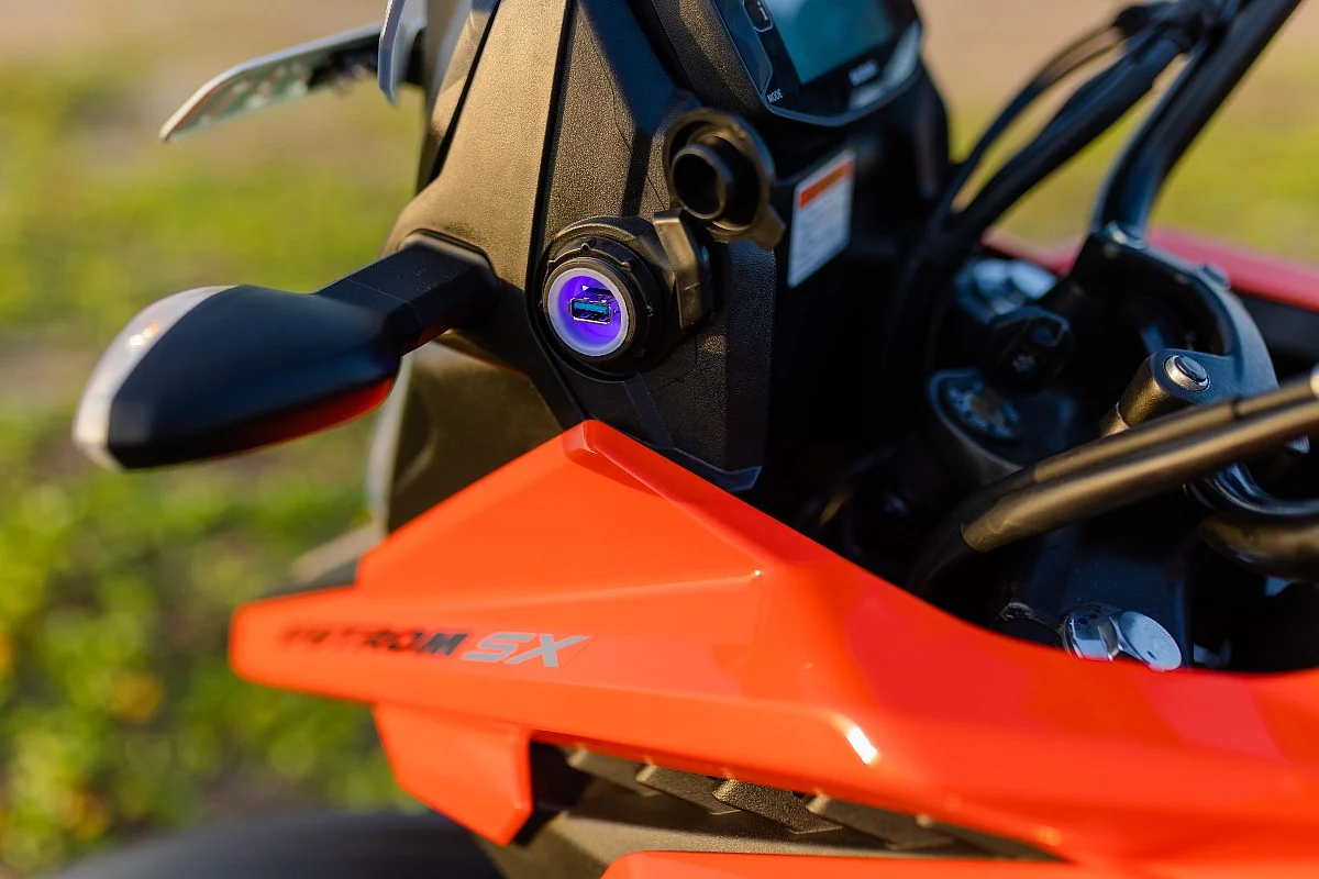 USB charger, a fully-digital instrument cluster, and dual-channel ABS available on the V-Strom SX