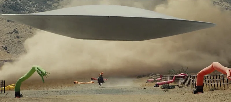 OJ (Daniel Kaluuya) flees from the alien in Nope (2022).