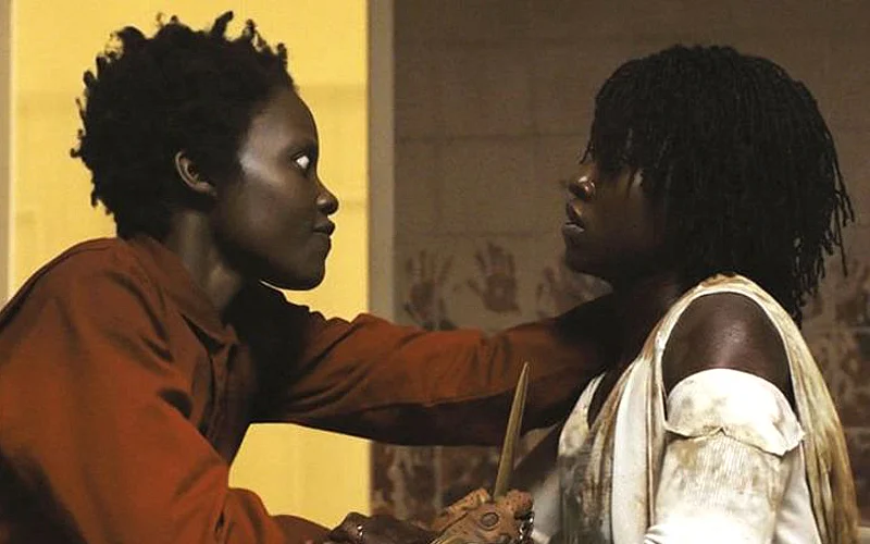 Red (Lupita Nyong'o) and Adelaide (Nyong'o) in Us (2019).