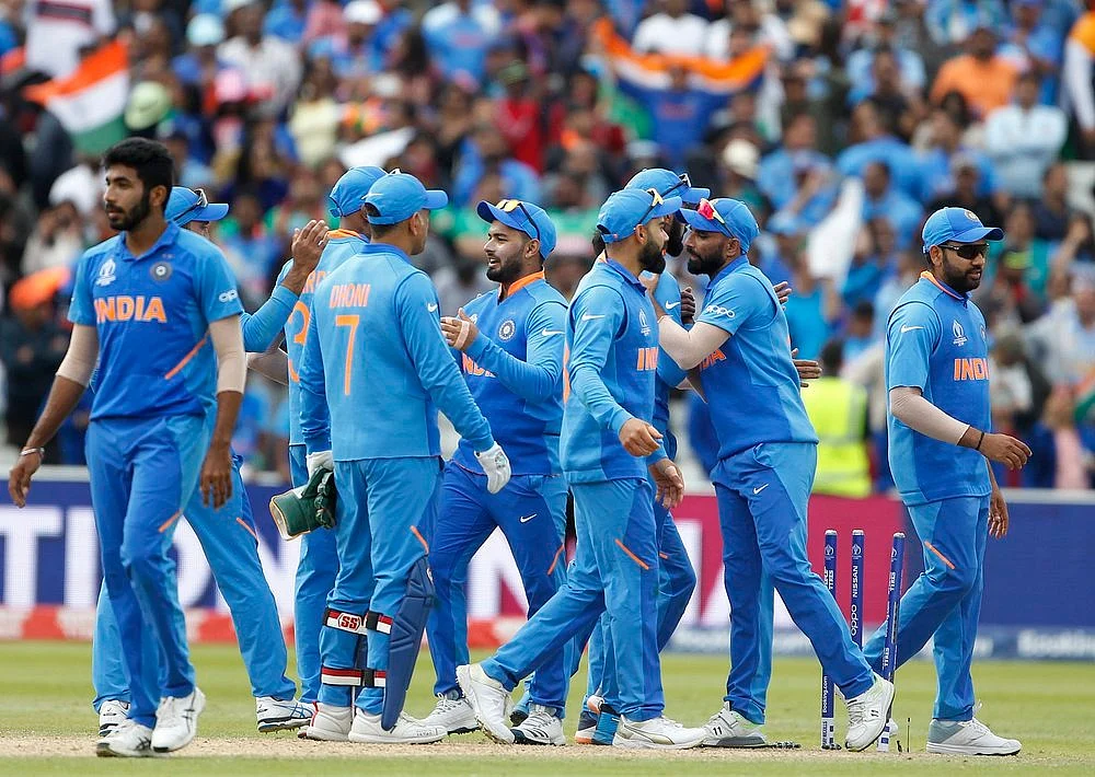 Indian squad celebrate after winning the match against Bangladesh in ICC CWC 2019 at Edgbaston in Birmingham on Tuesday