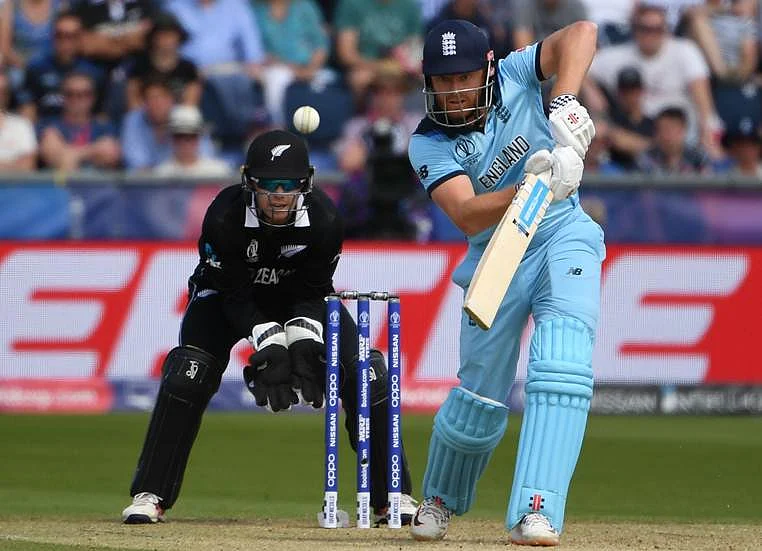 England's Jonny Bairstow (R) is watched by New Zealand's wicketkeeper Tom Latham as he plays a shot during the 2019 Cricket World Cup group stage match between England and New Zealand at the Riverside Ground, in Chester-le-Street, northeast England, on July 3, 2019.