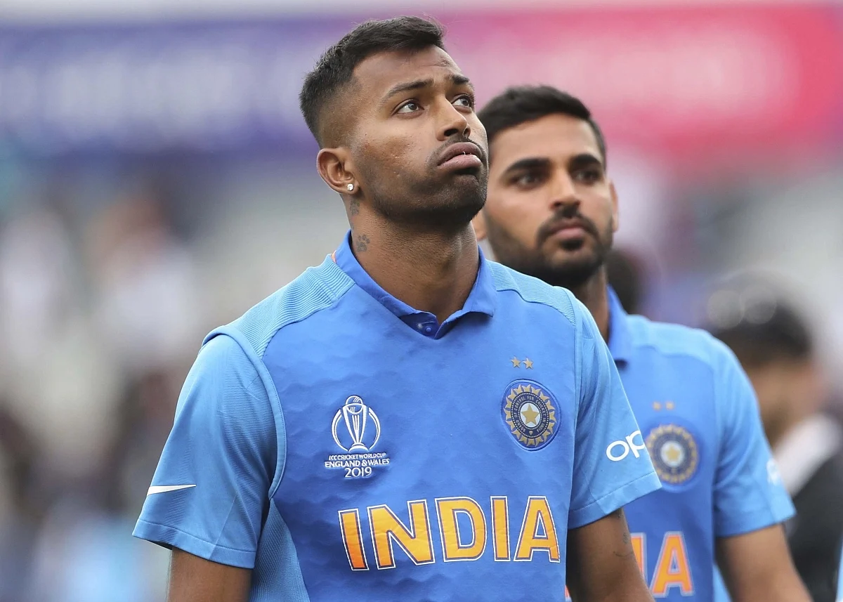 Hardik Pandya, left, reacts after their loss in the World Cup semi-final match against New Zealand.