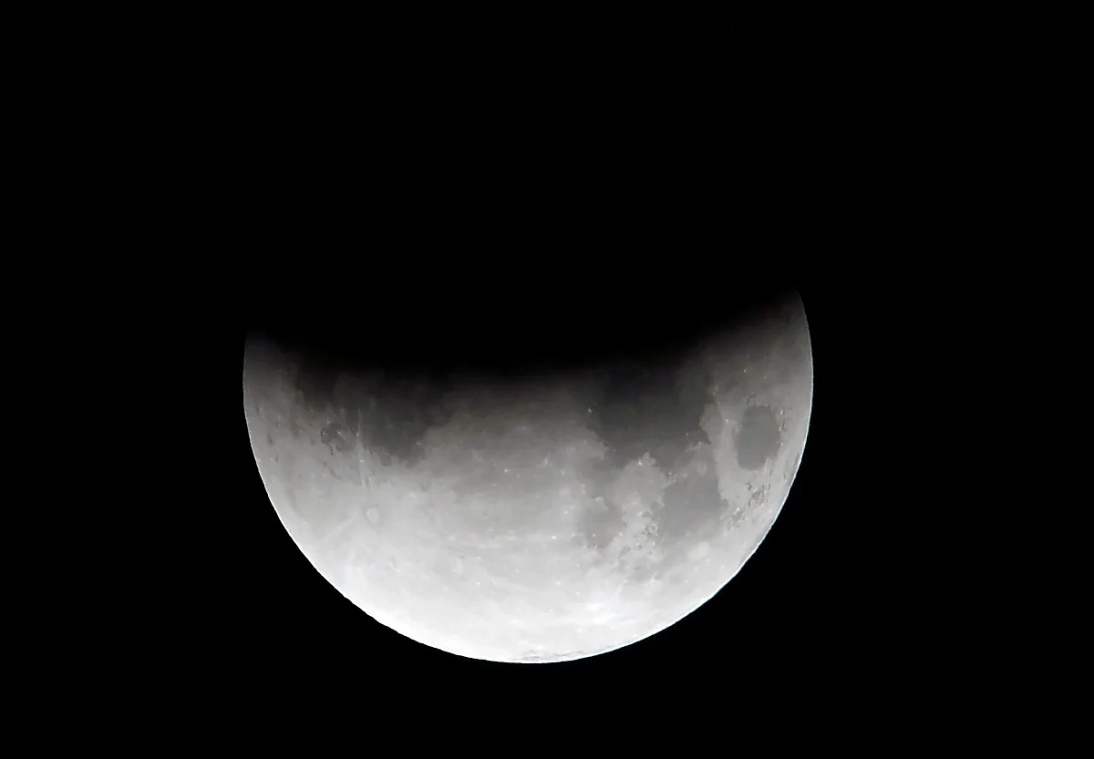 The moon is seen during a partial lunar eclipse in Islamabad