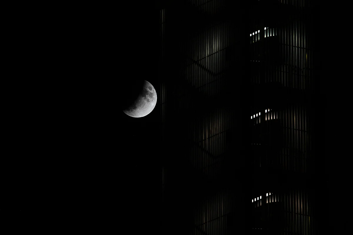 The moon is seen during a lunar eclipse in the sky over Rome, on July 16, 2019.