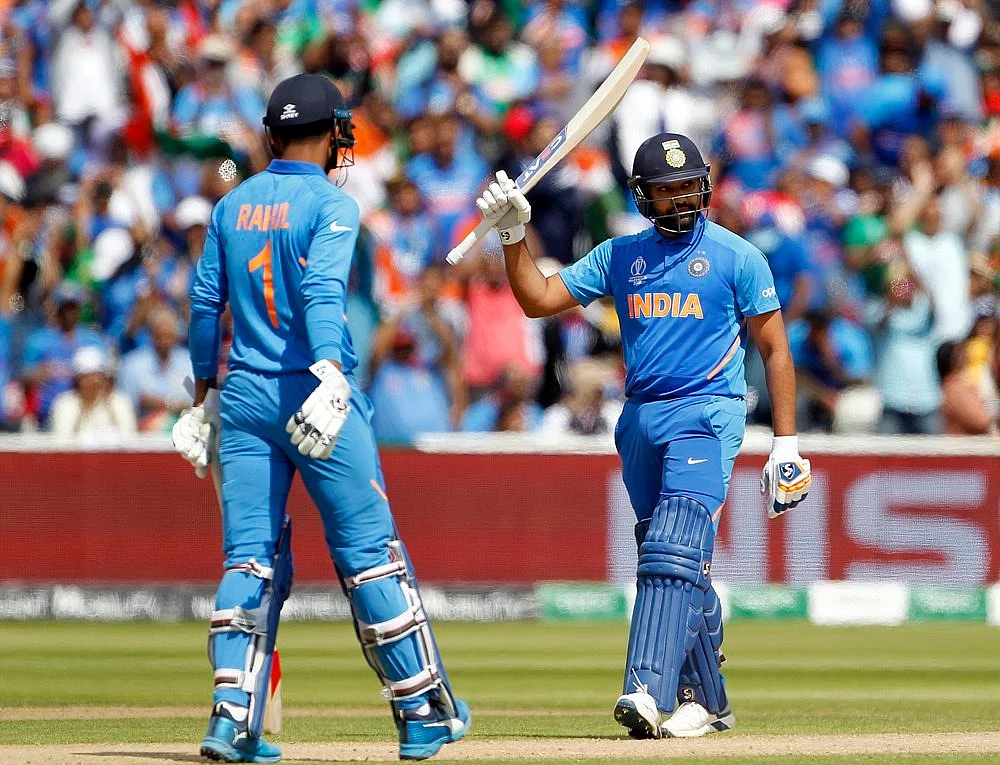 Indian batsman Rohit Sharma celebrates his half-century during a match against Bangladesh in ICC CWC 2019 at Edgbaston in Birmingham on Tuesday