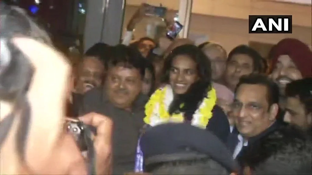PV Sindhu welcomed at IGI Airport on her return from Switzerland after winning the BWF World Championships, the first-ever Indian shuttler to achieve the feat