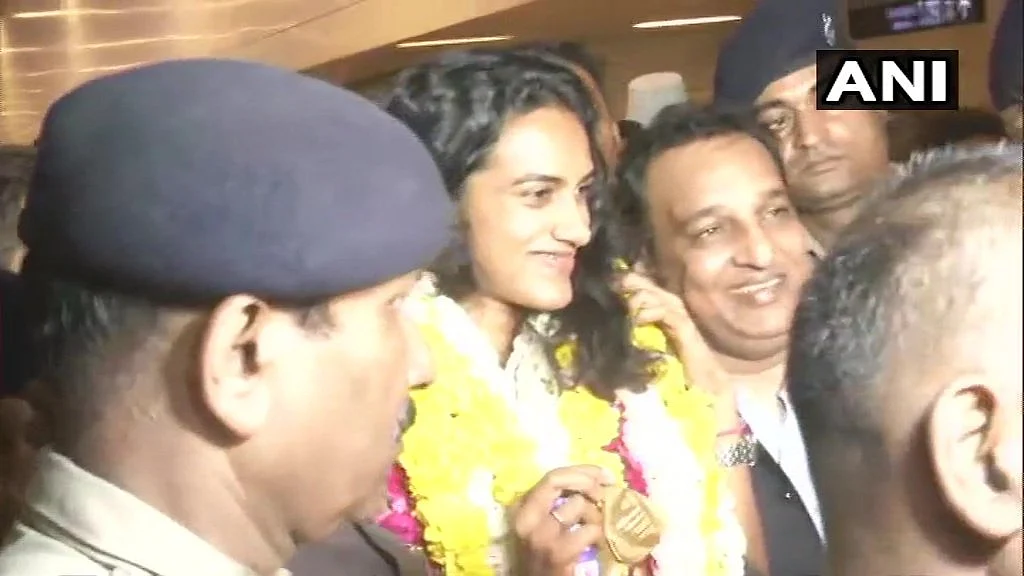 Delhi: PV Sindhu welcomed at IGI Airport on her return from Switzerland after winning the BWF World Championships, the first-ever Indian shuttler to achieve the feat; says, "a great moment for me. I am really very proud to be an Indian"