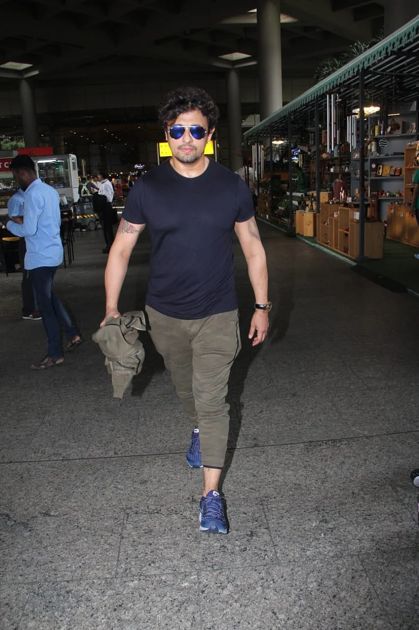 Singer Sonu Nigham was snapped in all black as he headed home after boarding a flight from London.