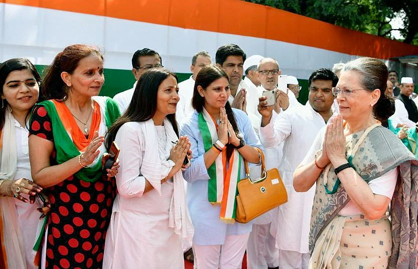 Congress Interim President Sonia Gandhi greets people during the celebration of 73rd Independence Day at AICC Headquarters in New Delhi