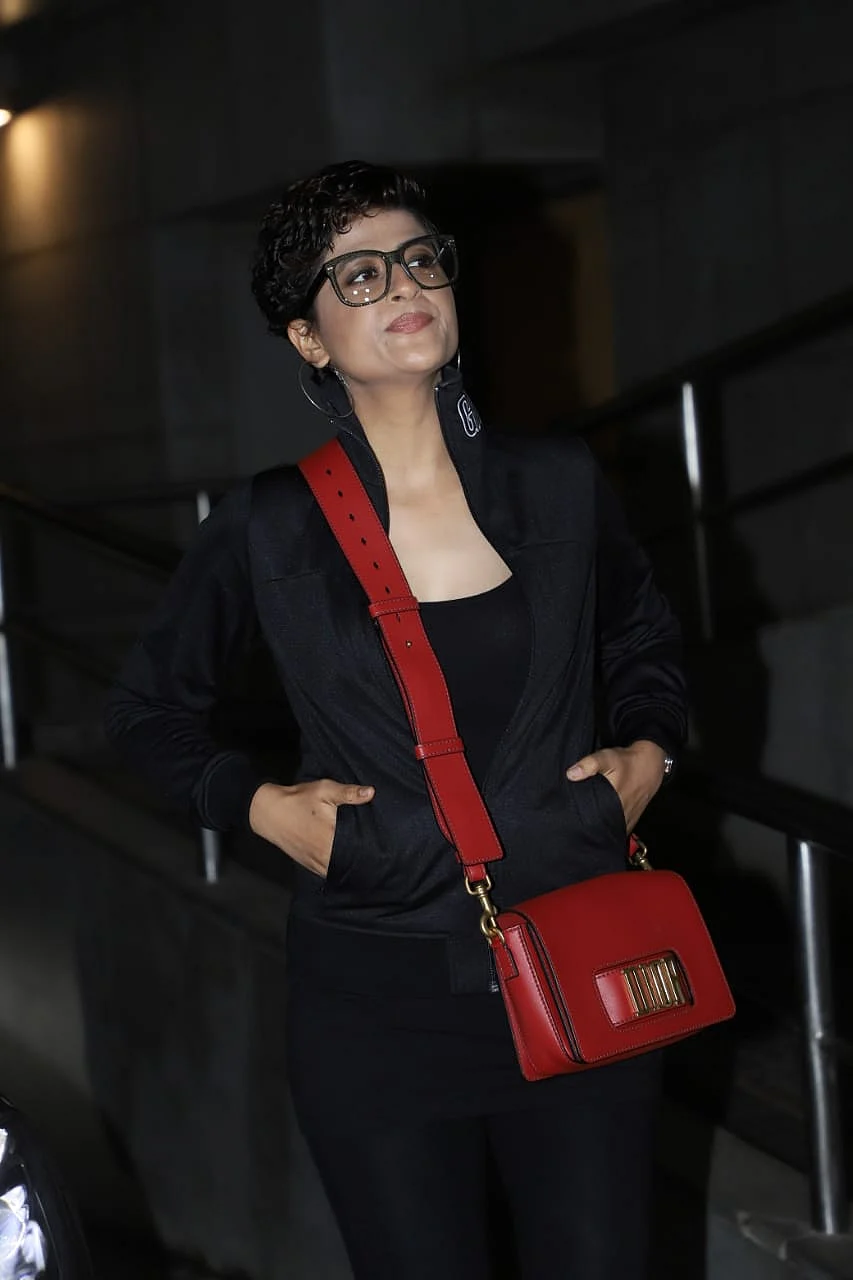 Tahira Kashyap was snapped in all black with a Dior red purse
