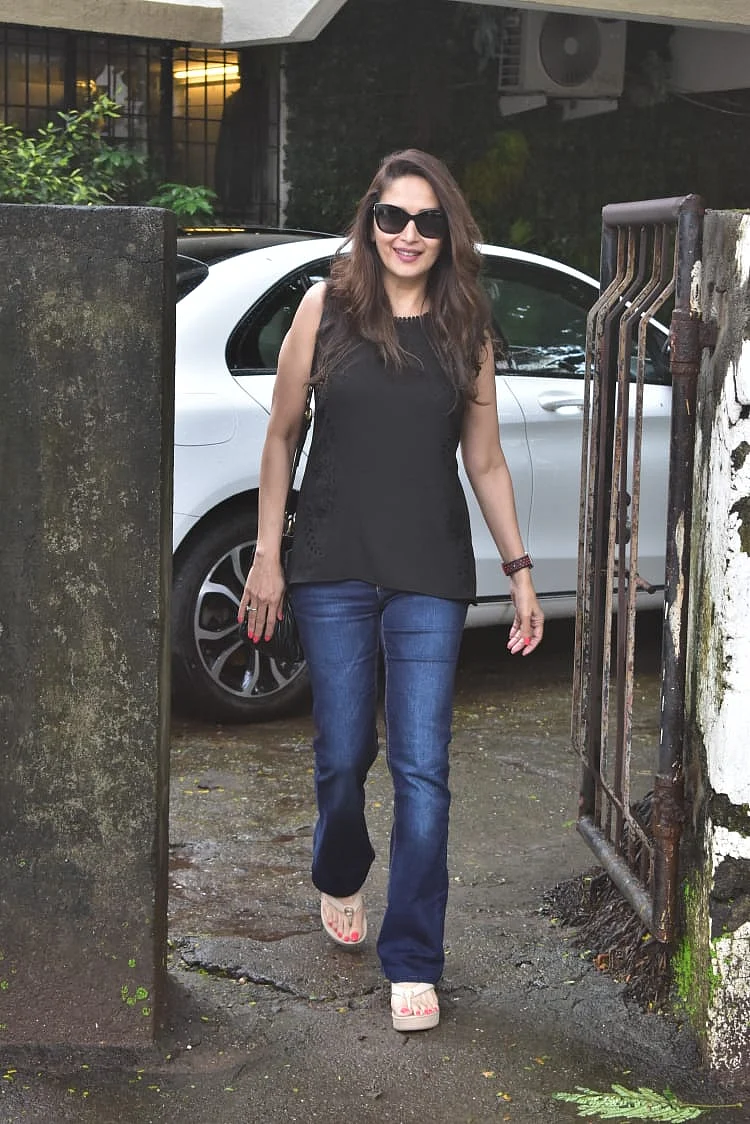 Madhuri Dixit Nene was seen around the city in a casual avatar, wearing a black top and blue jeans.