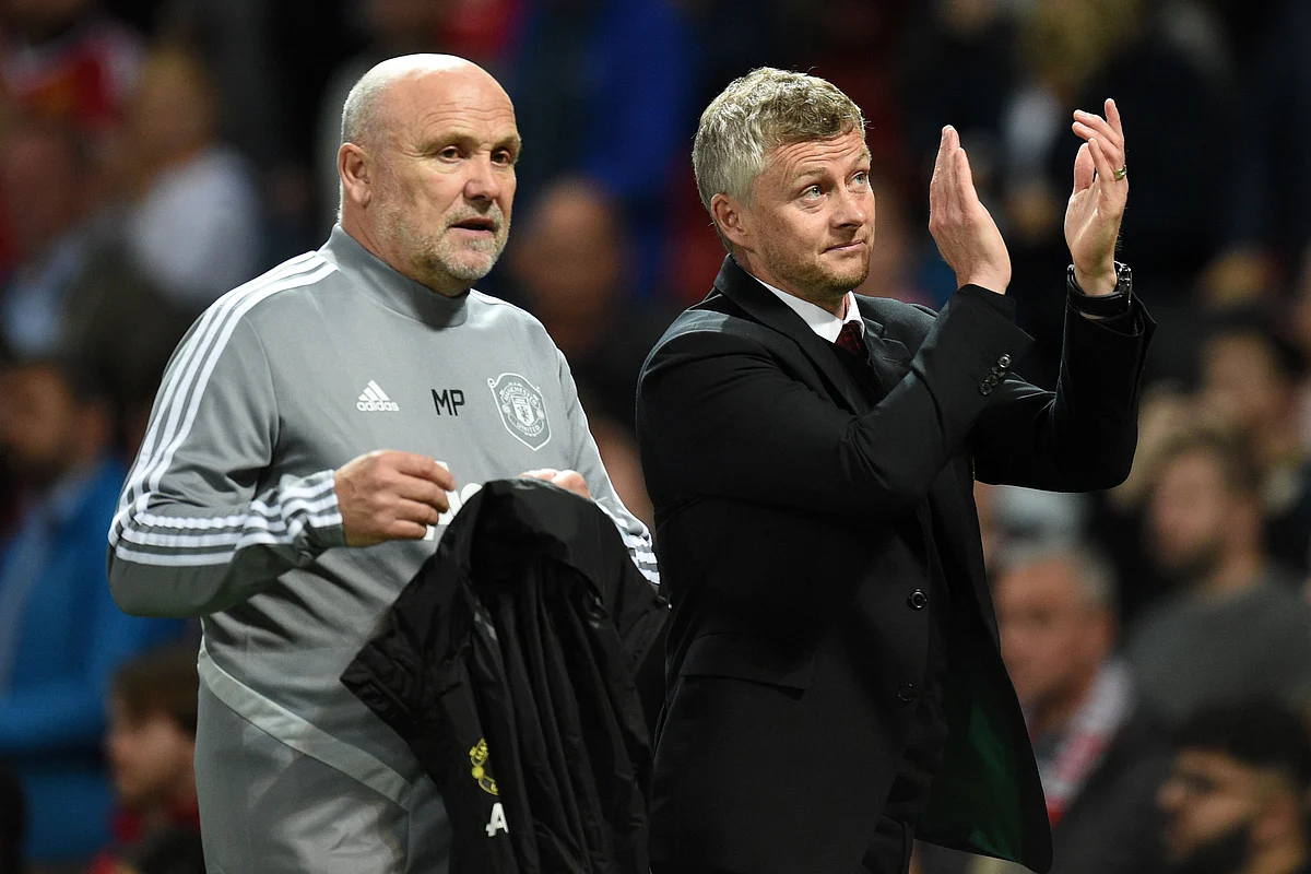Manchester United's Norwegian manager Ole Gunnar Solskjaer (R) and Manchester United's English first-team coach Mike Phelan (L) leave the pitch after the UEFA Europa League Group L football match between Manchester United and Astana at Old Trafford in Manchester, north west England, on September 19, 2019. - Manchester United won the game 1-0.