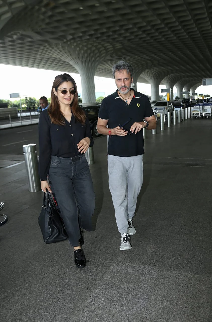 Raveena Tondon with husband at Mumbai airport