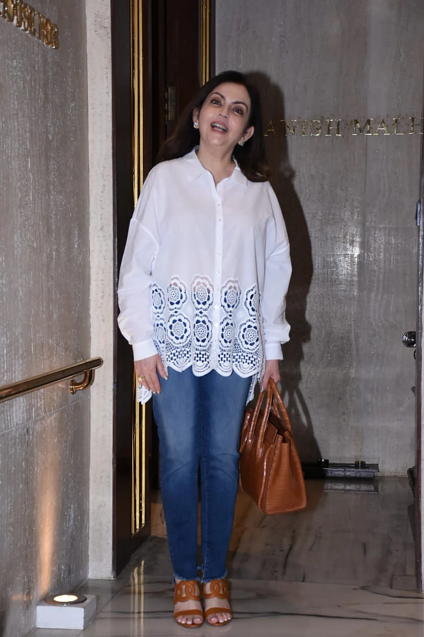 Nita Ambani keeps it simple yet stylish in a chic white shirt and blue jeans