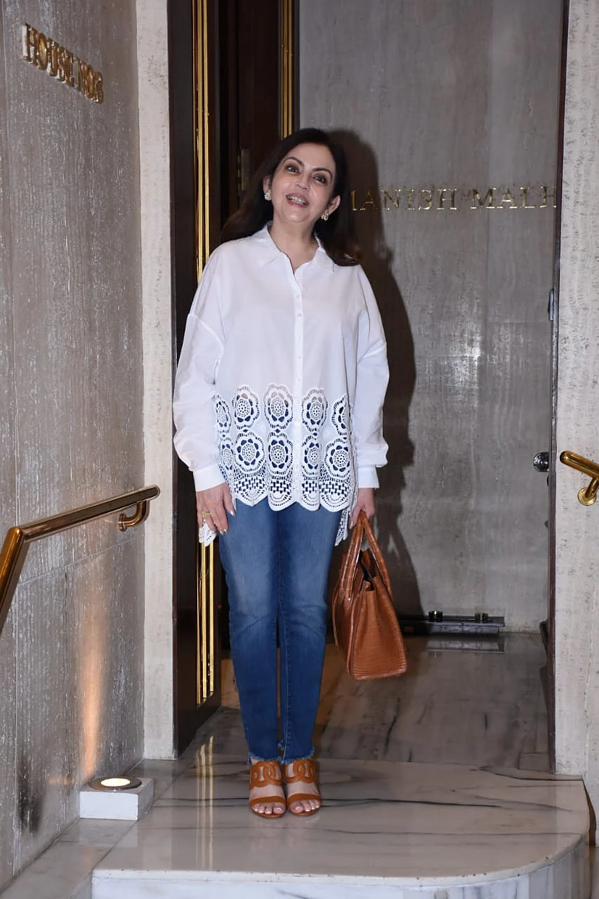 Nita Ambani keeps it simple yet stylish in a chic white shirt and blue jeans