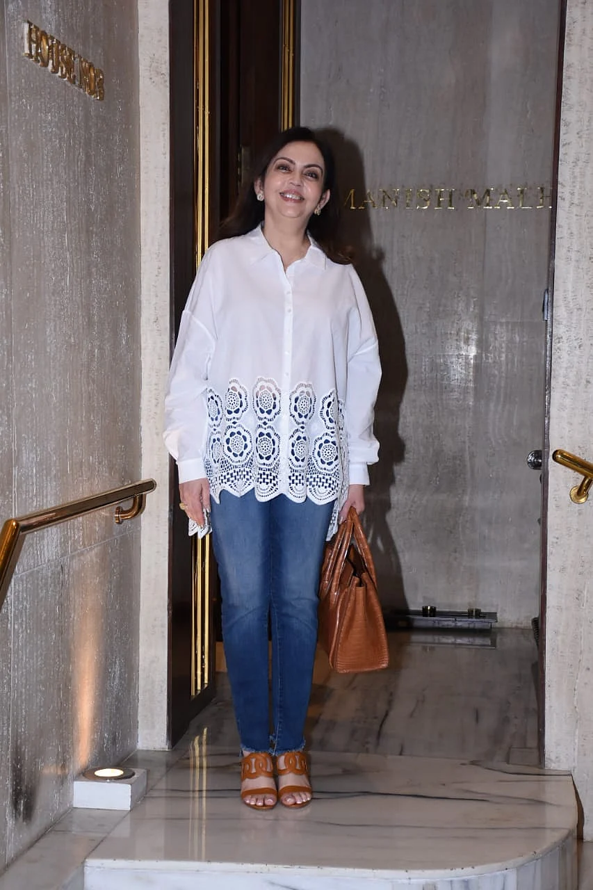 Nita Ambani keeps it simple yet stylish in a chic white shirt and blue jeans