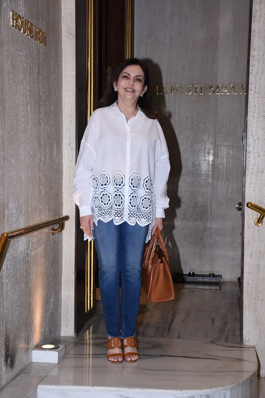 Nita Ambani keeps it simple yet stylish in a chic white shirt and blue jeans