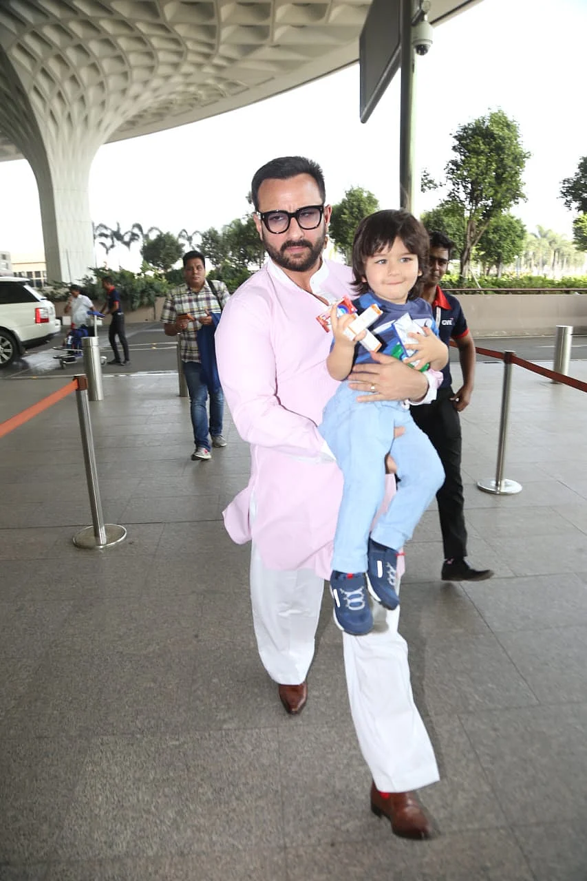 Taimur with Saif at the airport