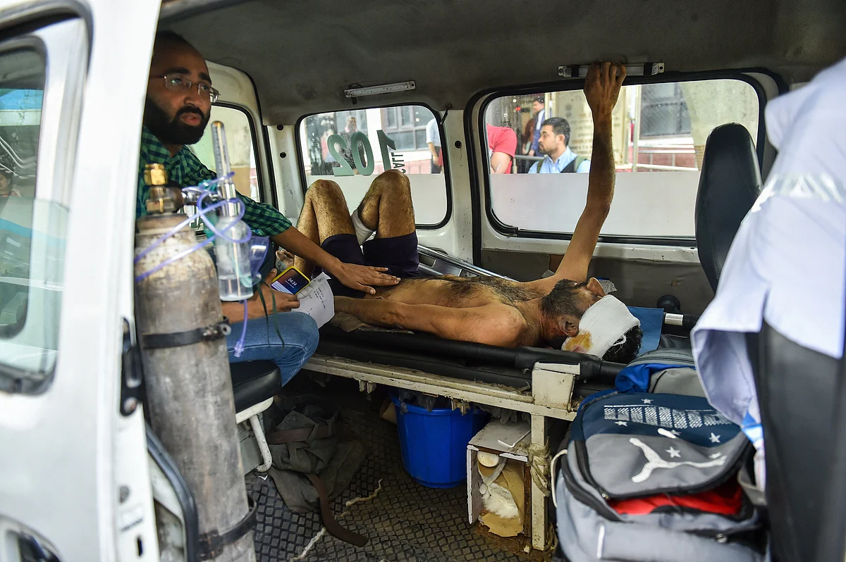A man injured during communal violence over the amended citizenship law in the riot-affected north east Delhi, being brought to GTB hospital for treatment, in east Delhi, Wednesday, Feb. 26, 2020.