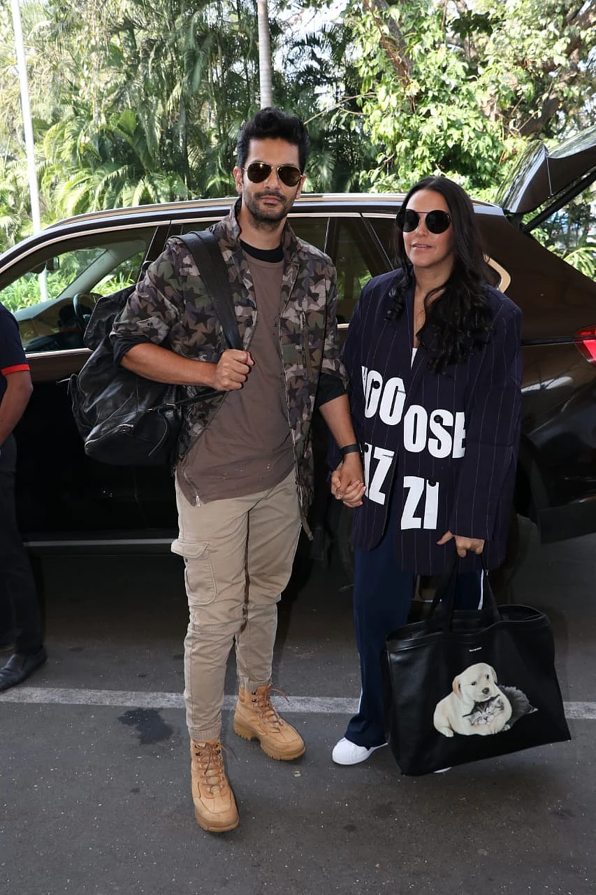 Neha Dhupia and husband Angad Bedi were snapped at the airport before they flew to Jaisalmer