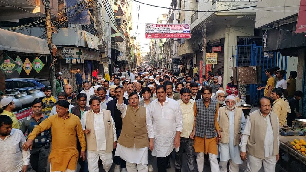 AAP leader Sanjay Singh leads a peace march in Gandhi Nagar.