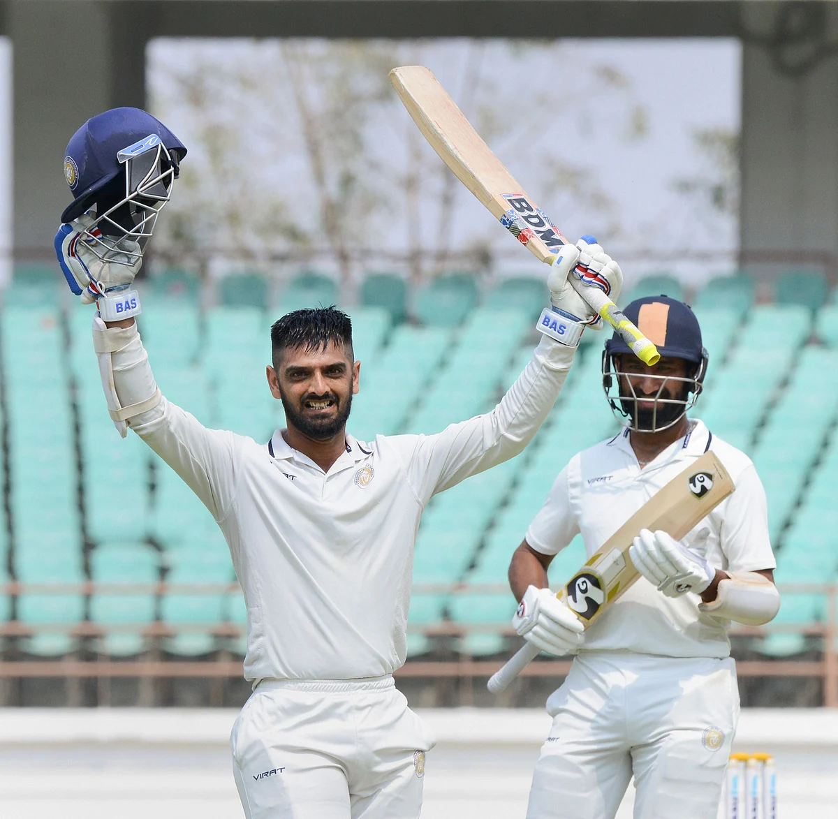 Saurashtra batsman Arpit Vasavada celebrates after scoring 100 runs during the Ranji final match against Bengal in Rajkot on Tuesday.