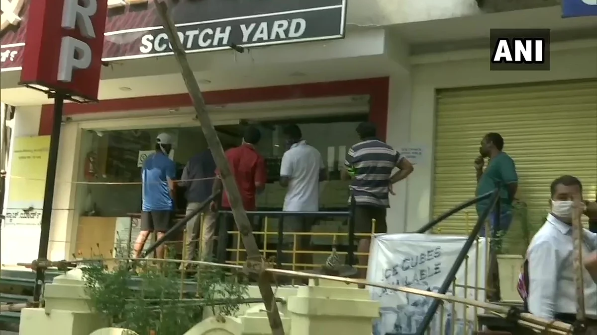 What social distancing? Booze lovers throng to liquor shops as MHA relaxes rules on sale of alcohol; Watch video