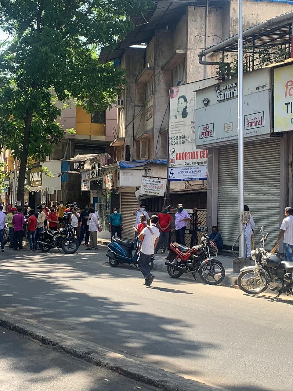 Tipplers at Thane's famous Gokhale Road queue up to anxiously wait for the opening of liquor shop and its purchase