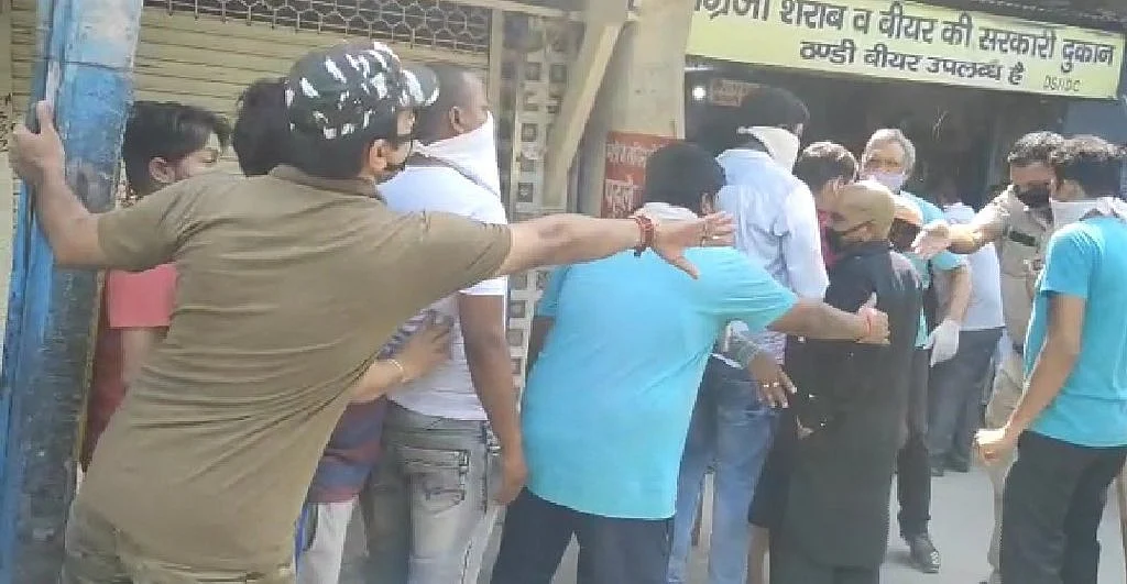 What social distancing? Booze lovers throng to liquor shops as MHA relaxes rules on sale of alcohol; Watch video