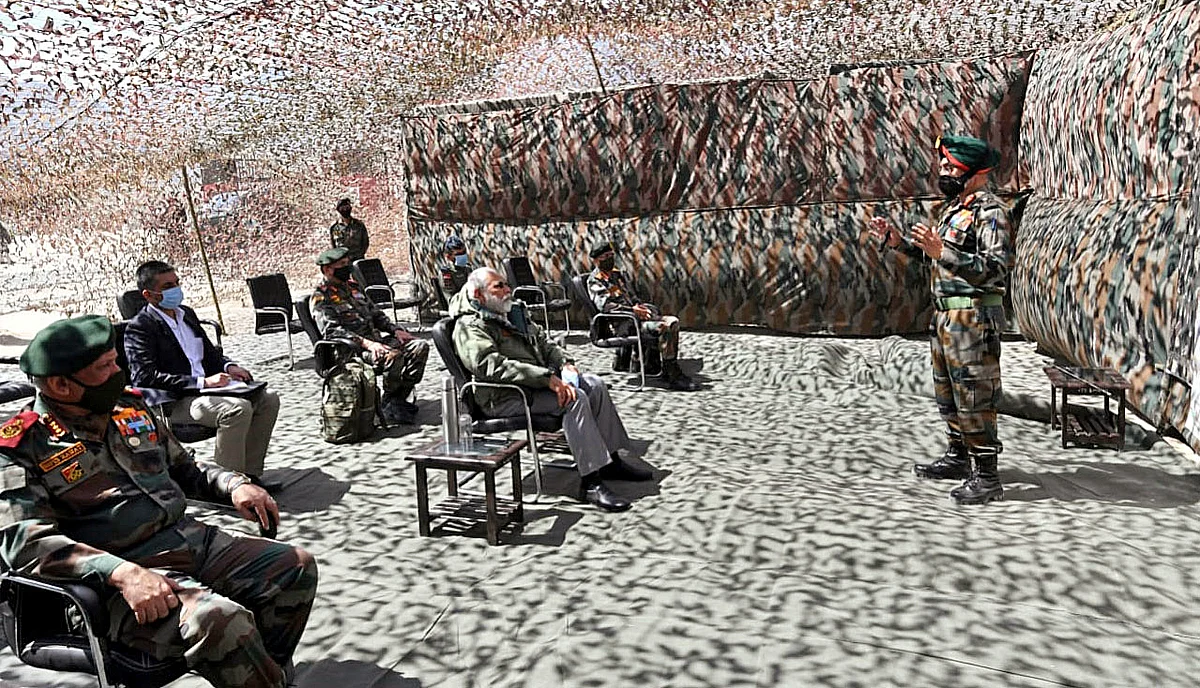 Prime Minister Narendra Modi makes a surprise visit to Ladakh, being briefed by senior officials at a forward position in Nimu on Friday.