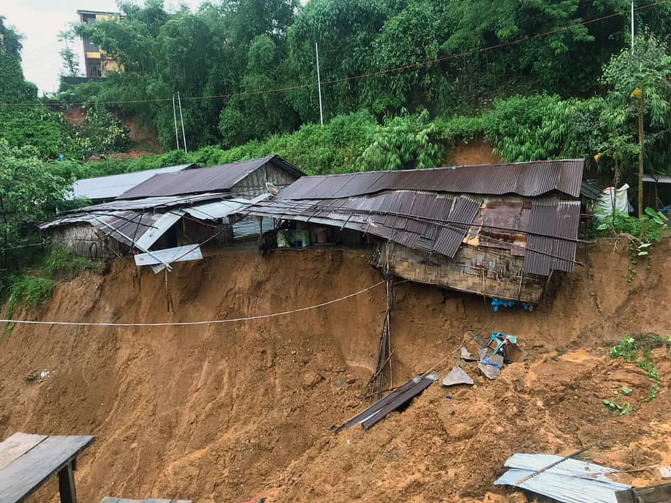 Houses damaged after a massive landslide due to incessant rainfall, in Itanagar on Thursday.
