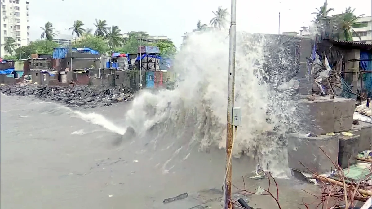 Waves crash ashore during high tide, at Colaba in Mumbai on Sunday