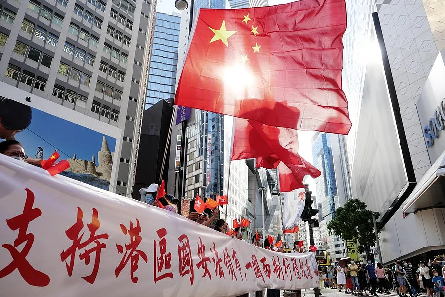 Hong Kong citizens celebrate the passage of the Law of the People's Republic of China on Safeguarding National Security in the Hong Kong Special Administrative Region (HKSAR) in Causeway Bay of south China's Hong Kong, June 30, 2020