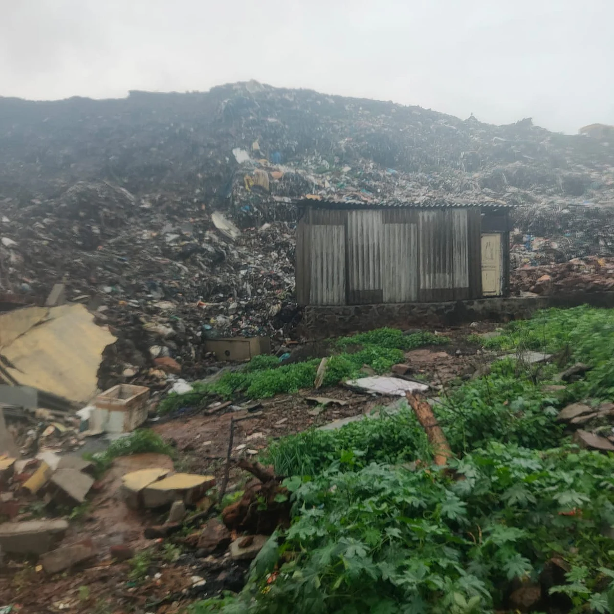 Garbage mountain crashes on hutments near Uttan Dump Yard.