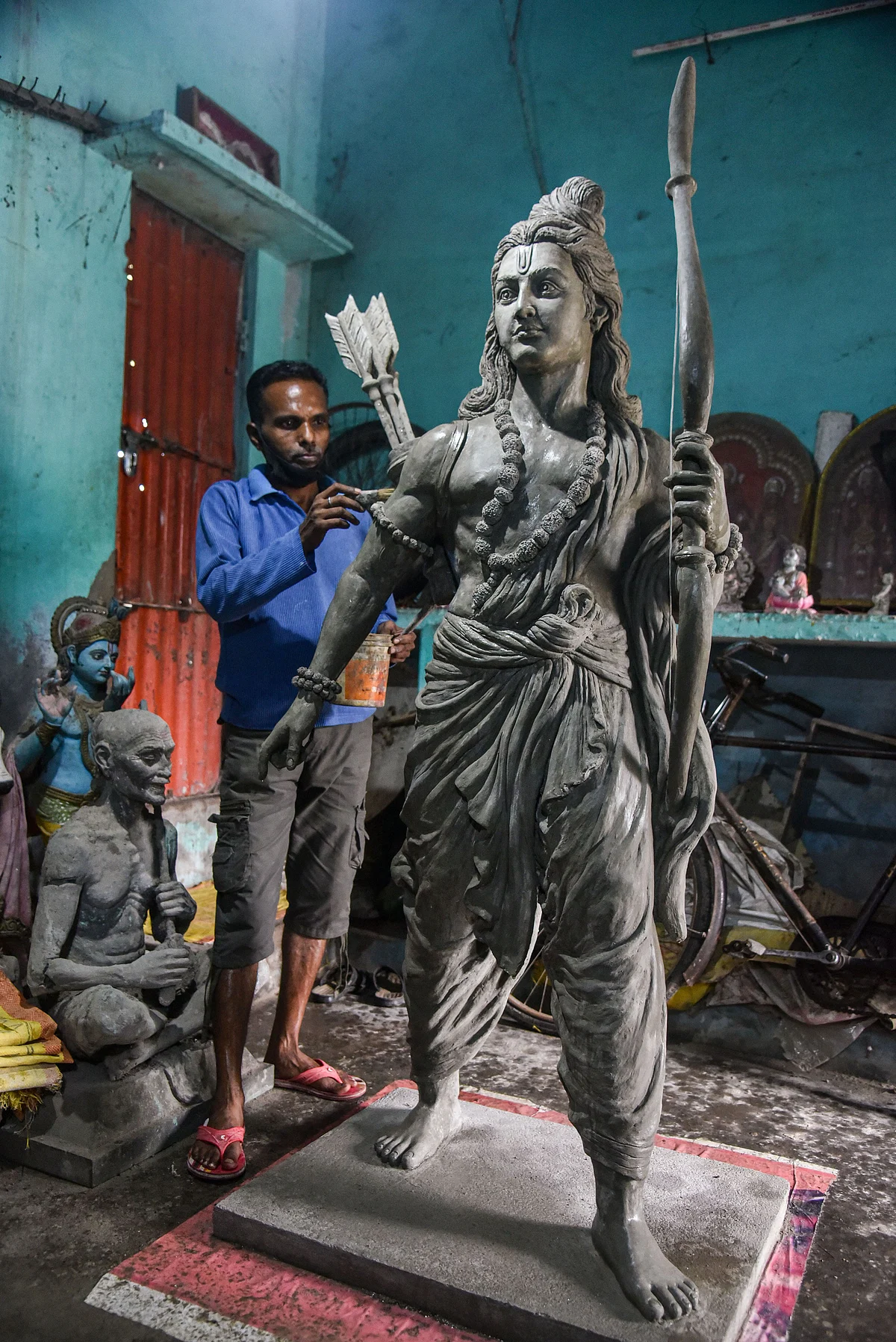 Artisan gives a final touch to a sculpture of Lord Ram during preparations ahead of the foundation laying ceremony of Ram Temple, in Ayodhya