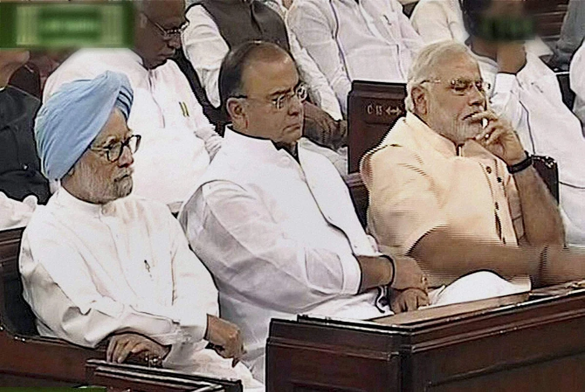 PM Narendra Modi with former PM Manmohan Singh and Finance Minister Arun Jaitley during President Pranab Mukherjee's address to the joint session of Parliament in New Delhi on 09/06/2014.