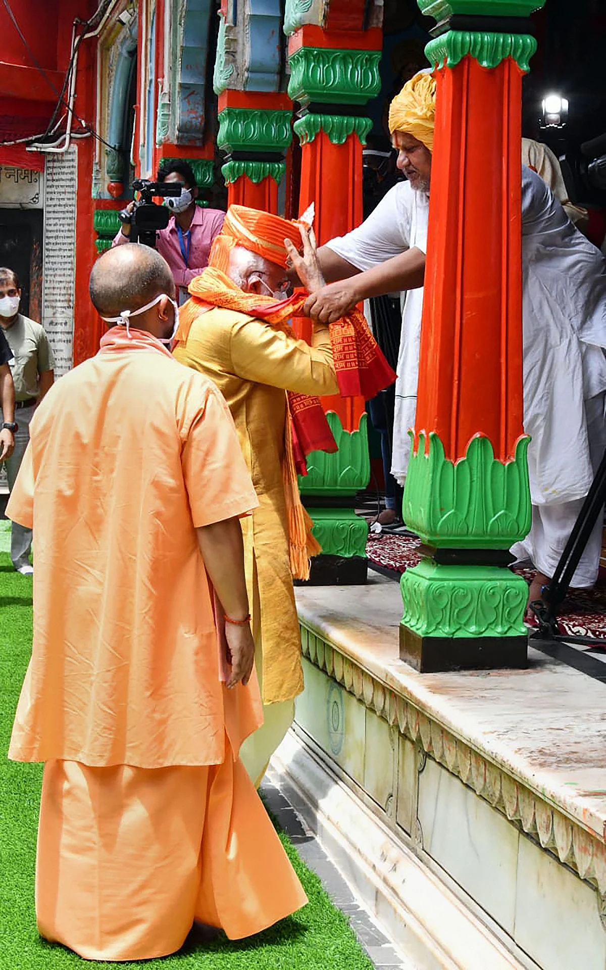 Prime Minister Narendra Modi along with Uttar Pradesh Chief Minister Yogi Adityanath being felicitated by a priest during his visit to Hanuman Garhi, in Ayodhya.