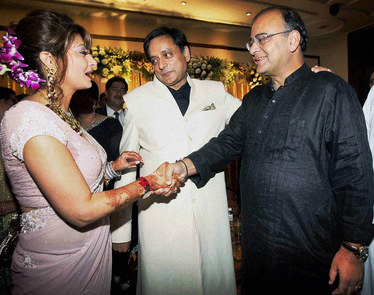 BJP leader Arun Jaitley greets newly wedded couple Shashi Tharoor and Sunanda Pushkar at their reception party in New Delhi in 2010.