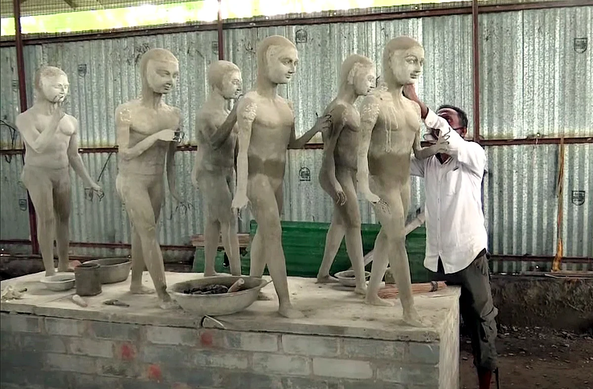 A worker preparing the design of the statues at the Ram temple site, in Ayodhya