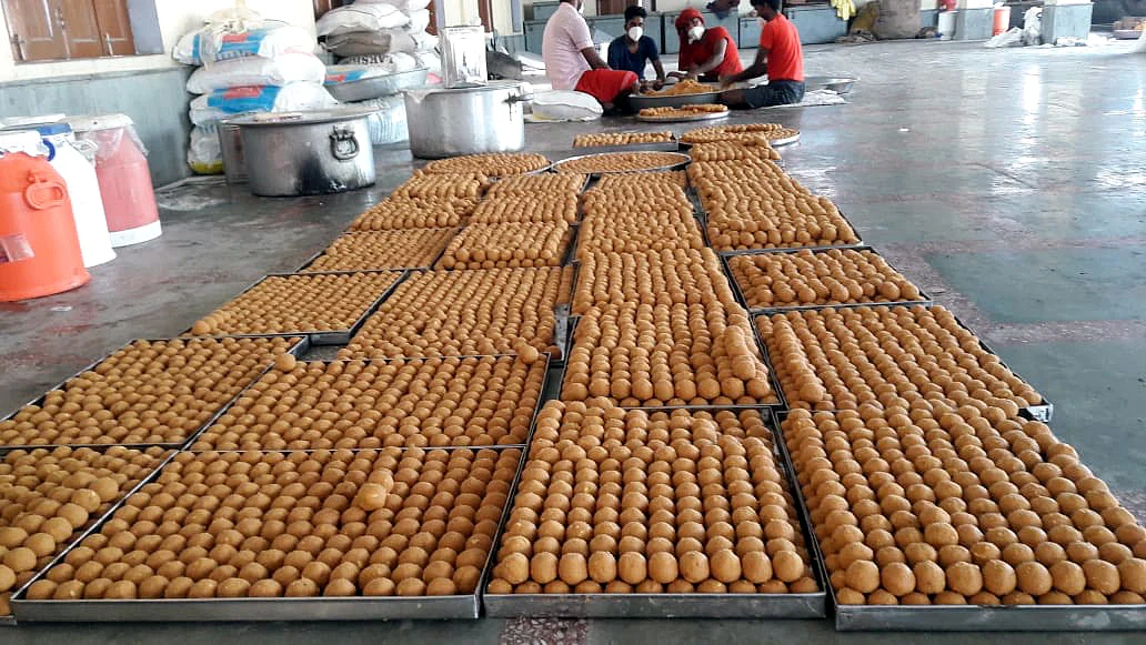 Workers preparing laddoos for Prasadam ahead of foundation laying ceremony of Ram temple