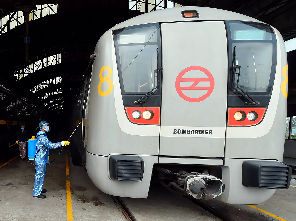 aration underway at the metro station as Delhi Metro rail gears up to resume services from Monday as part of Unlock 4, in New Delhi on Sunday.