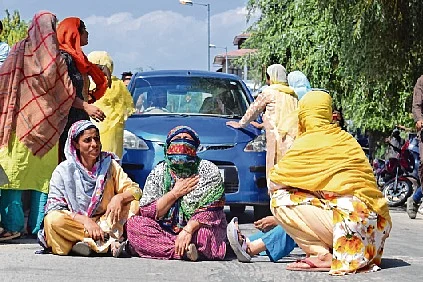 Family members and relatives stage a protest against the alleged custodial death of Irfan Ahmad Dar (24) at Sopore town of Baramulla district in Kashmir.