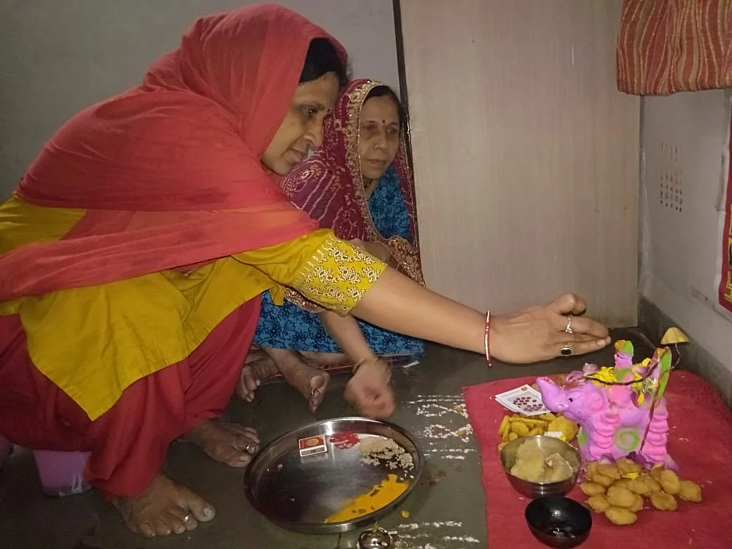 Women worshipping the Gaja Laxmi form of the goddess on the concluding day of 15-day Mahalaxmi Vrat